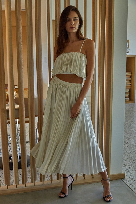 a woman standing in front of a wooden wall