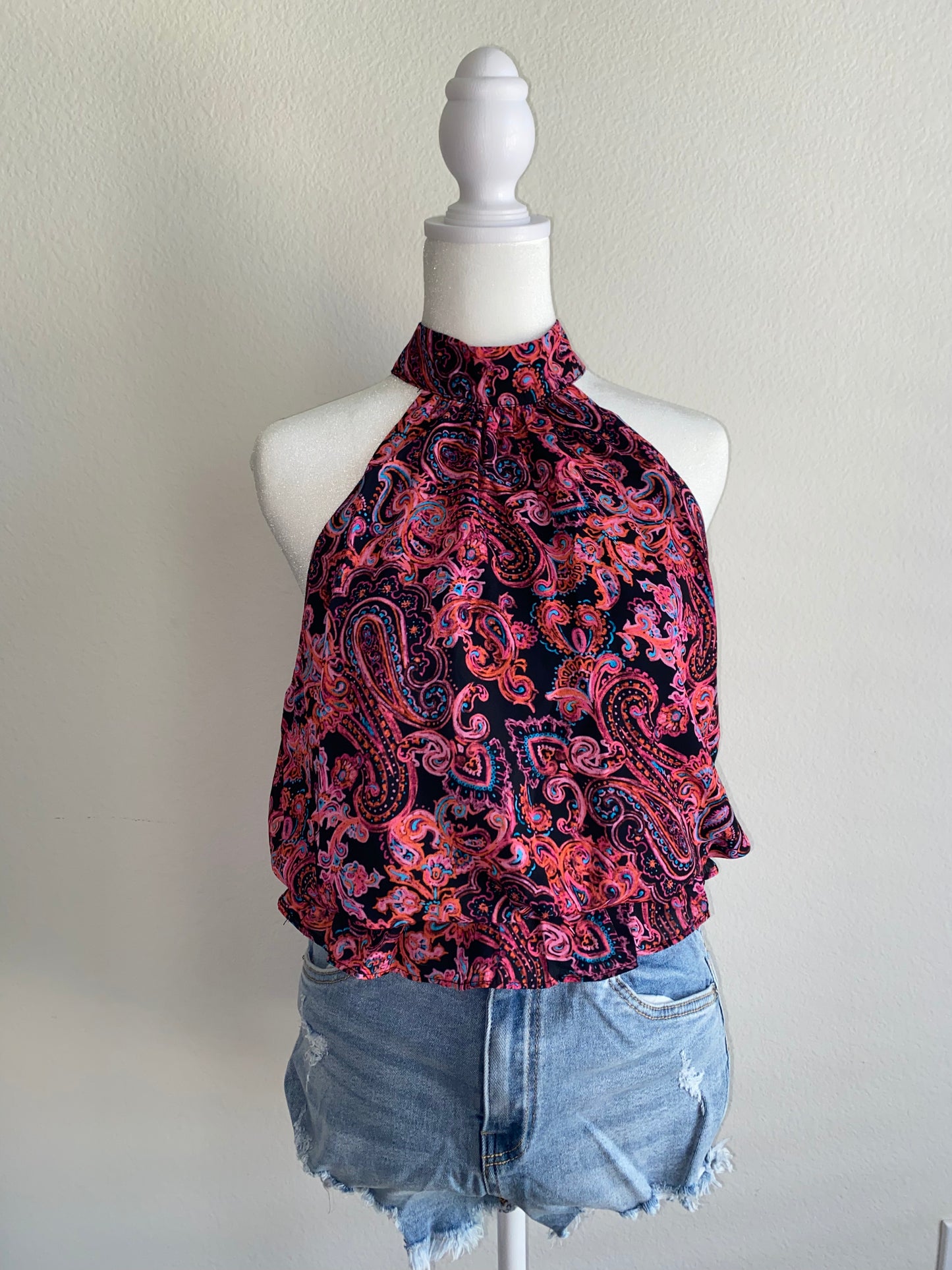 a woman's top on a mannequin head