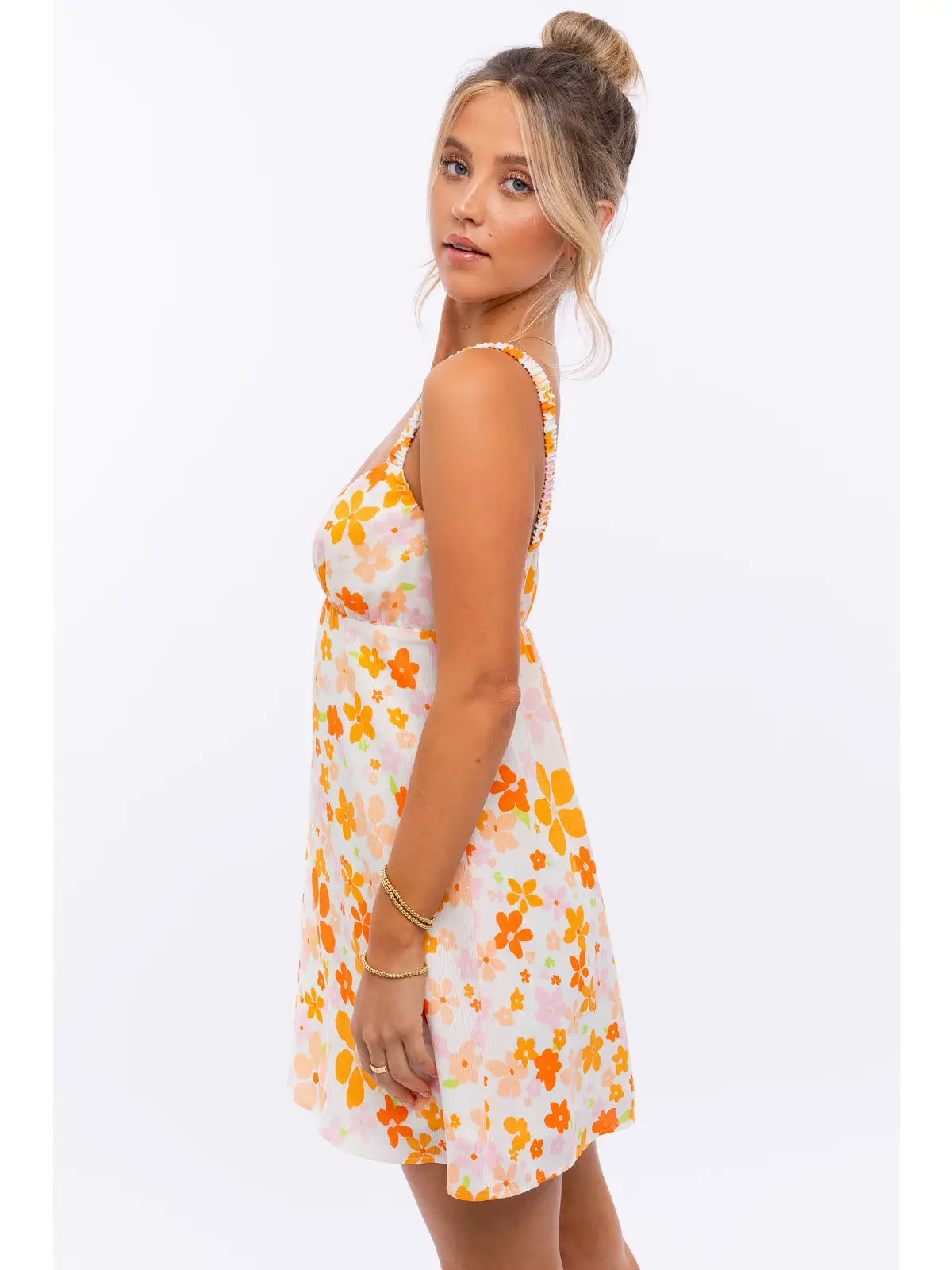 a woman in a dress is posing for a picture