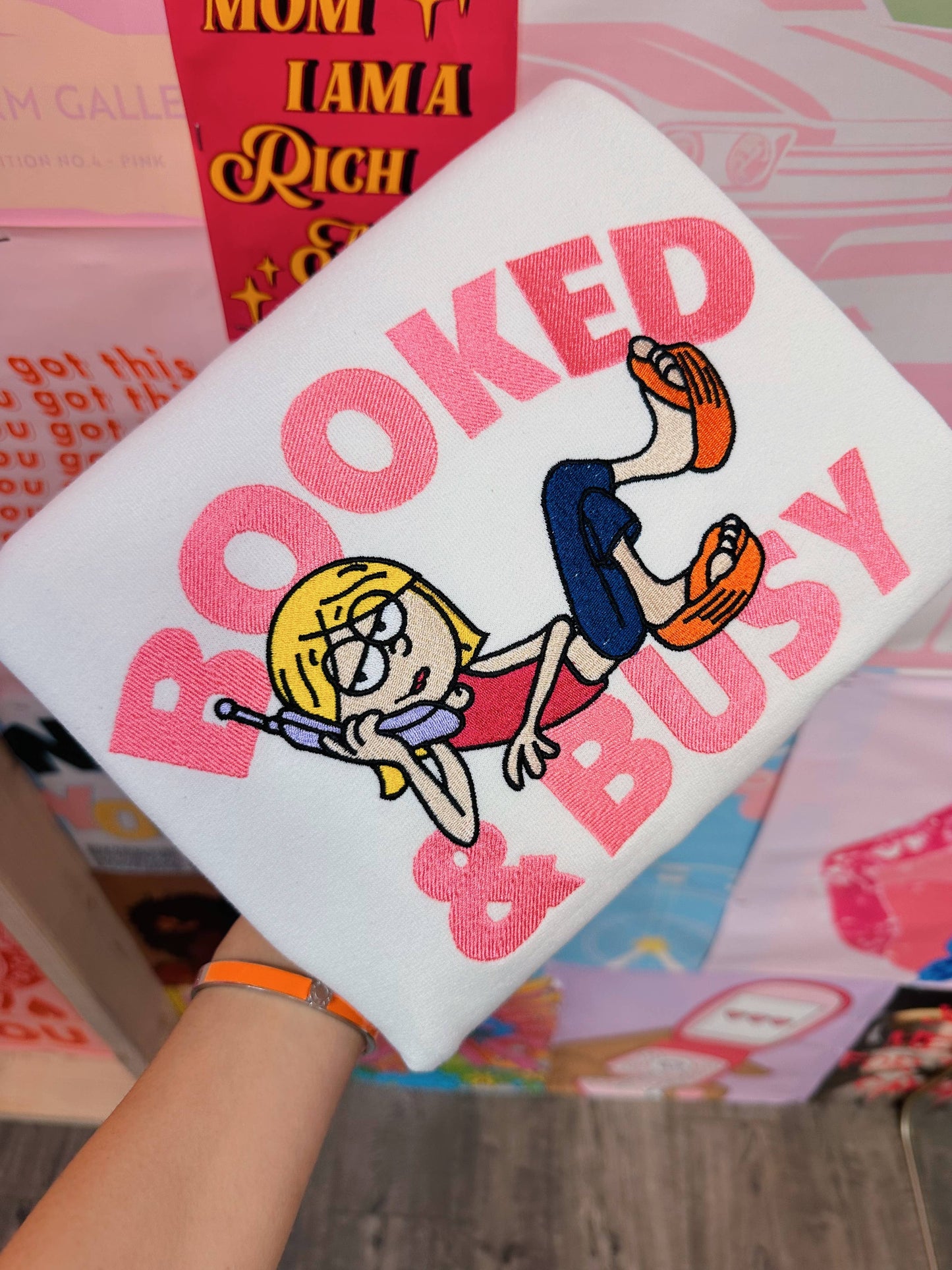 a person holding a pillow with a cartoon picture on it